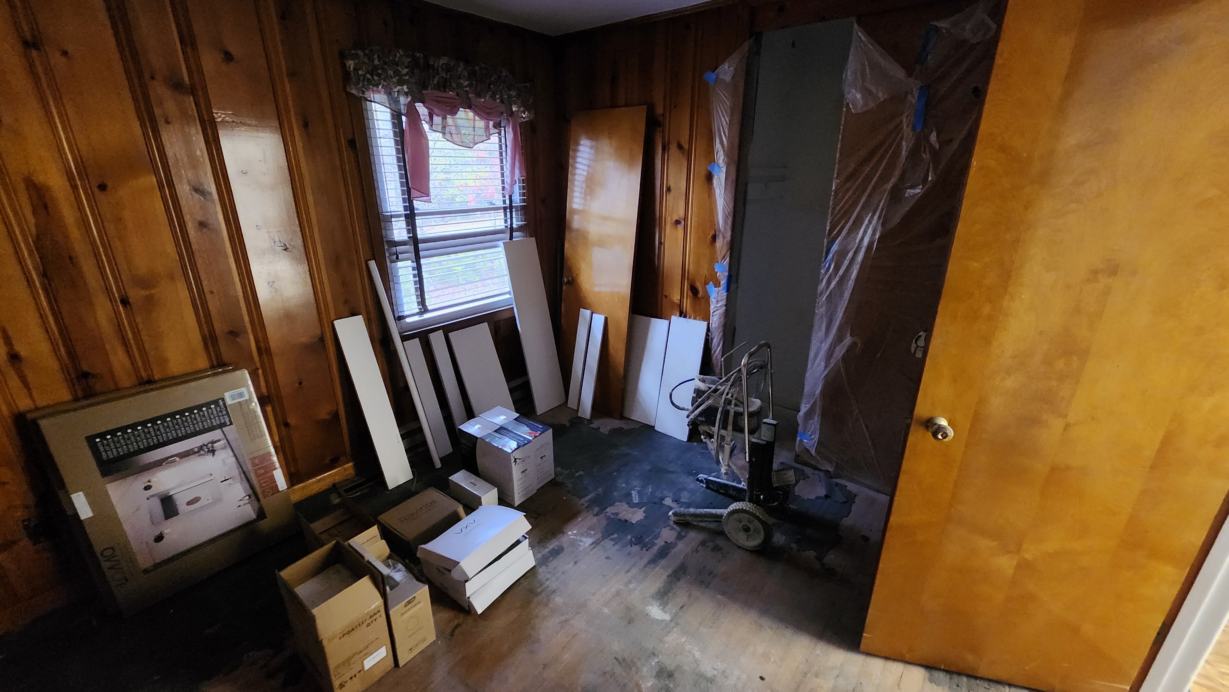 Room filled with stored belongings and renovation materials